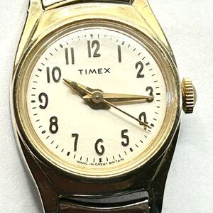 Vintage Timex Gold-Tone Watch with White Face